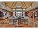 Elegant lobby featuring high ceilings, brick accents, comfortable seating, and access to outdoor views at 9734 S 182Nd Dr, Goodyear, AZ 85338