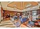 Spacious lobby area with comfortable seating, high ceilings, brick accents, and a welcoming atmosphere at 9734 S 182Nd Dr, Goodyear, AZ 85338