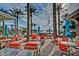 Outdoor patio featuring lounge seating with colorful umbrellas and views of community amenities at 9734 S 182Nd Dr, Goodyear, AZ 85338