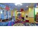 Bright playroom with colorful decor, various toys, and a whimsical atmosphere for children to enjoy at 9734 S 182Nd Dr, Goodyear, AZ 85338