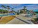 Community pool area with waterslides, lounging areas, and ample seating under shaded canopies at 9734 S 182Nd Dr, Goodyear, AZ 85338