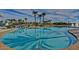 Large community pool with water features and ample space for recreation and relaxation at 9734 S 182Nd Dr, Goodyear, AZ 85338