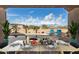 Outdoor dining area with a view of the pool, landscaping and clear blue skies at 9734 S 182Nd Dr, Goodyear, AZ 85338