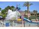 Gathering-friendly community pool with play structure and splash area for all ages at 9734 S 182Nd Dr, Goodyear, AZ 85338