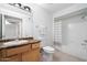 Full bathroom with shower/tub combo, neutral tile, wood vanity, and modern fixtures at 9990 N Scottsdale Rd # 1006, Paradise Valley, AZ 85253