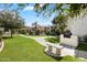 Well-manicured lawn and outdoor BBQ grill area for community residents to enjoy at 9990 N Scottsdale Rd # 1006, Paradise Valley, AZ 85253