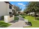 Manicured lawn with bench seating and an outdoor community BBQ grill at 9990 N Scottsdale Rd # 1006, Paradise Valley, AZ 85253