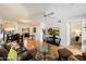 Bright living room boasts hardwood floors, a ceiling fan, and an open layout with a kitchen view at 9990 N Scottsdale Rd # 1006, Paradise Valley, AZ 85253