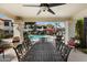 Outdoor community space with large table and chairs overlooking the pool at 9990 N Scottsdale Rd # 1006, Paradise Valley, AZ 85253