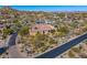 An aerial view of a desert community featuring beautiful landscaping and stunning mountain views at 10798 E Hedgehog Pl, Scottsdale, AZ 85262