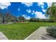 Lush backyard with green grass and desert landscaping at 10798 E Hedgehog Pl, Scottsdale, AZ 85262