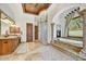 Bathroom features a luxurious tub, double sinks, and tile flooring at 10798 E Hedgehog Pl, Scottsdale, AZ 85262