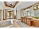 Spacious bathroom features double sinks, natural lighting, and tile flooring at 10798 E Hedgehog Pl, Scottsdale, AZ 85262