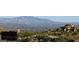 Scenic desert landscape featuring mountains and native vegetation against a backdrop of a clear blue sky at 10798 E Hedgehog Pl, Scottsdale, AZ 85262