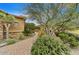 Landscaped front entrance with a stone path leading to the front door at 10798 E Hedgehog Pl, Scottsdale, AZ 85262