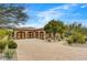 Exterior of home showcasing the driveway and a multi-car garage at 10798 E Hedgehog Pl, Scottsdale, AZ 85262