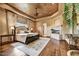 Spacious main bedroom features a fireplace, ceiling fan, and hardwood floors at 10798 E Hedgehog Pl, Scottsdale, AZ 85262