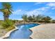 Sparkling pool surrounded by desert landscaping and featuring a tanning ledge at 10798 E Hedgehog Pl, Scottsdale, AZ 85262