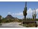 Brown's Ranch Trailhead sign with desert landscape featuring a saguaro cactus under a partly cloudy blue sky at 10798 E Hedgehog Pl, Scottsdale, AZ 85262