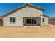 Back exterior view of the home highlighting the covered patio and stucco at 1187 E Ridgerock St, Casa Grande, AZ 85122