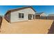 View of the home and backyard featuring stucco and window views at 1187 E Ridgerock St, Casa Grande, AZ 85122