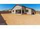 Backyard view of home featuring patio and stucco exterior at 1187 E Ridgerock St, Casa Grande, AZ 85122