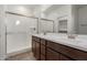 Bathroom boasts double vanity sinks, tile floors, and a glass shower enclosure at 1187 E Ridgerock St, Casa Grande, AZ 85122