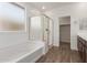 Bathroom featuring a shower, separate soaking tub, and a door to a walk-in closet at 1187 E Ridgerock St, Casa Grande, AZ 85122