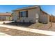 Attractive single-story home with a landscaped front yard and a partially fenced yard at 1187 E Ridgerock St, Casa Grande, AZ 85122