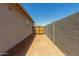 Side yard featuring block wall and gated entrance to the backyard at 1187 E Ridgerock St, Casa Grande, AZ 85122