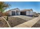 Desirable single-story home with a spacious driveway and a two car garage, offering convenience and curb appeal at 1191 E Ridgerock St, Casa Grande, AZ 85122