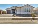 Charming single-story home with a well-manicured front yard and inviting entrance, creating a welcoming curb appeal at 1191 E Ridgerock St, Casa Grande, AZ 85122