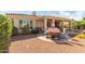 Outdoor dining area with a patio setup, surrounded by landscape and backyard elements at 12752 W Junipero Dr, Sun City West, AZ 85375