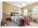 Comfortable bedroom featuring a ceiling fan, neutral decor, and a patterned rug at 12752 W Junipero Dr, Sun City West, AZ 85375