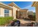 Charming courtyard entry featuring desert landscaping and a cozy seating area at 12752 W Junipero Dr, Sun City West, AZ 85375