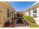 Private courtyard featuring desert landscaping and hardscape, perfect for outdoor relaxation at 12752 W Junipero Dr, Sun City West, AZ 85375