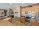 Efficient kitchen layout featuring stainless appliances, granite countertops, and tiled flooring at 12752 W Junipero Dr, Sun City West, AZ 85375