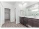 Bathroom featuring double vanity sinks and a large mirror at 13242 W Hackamore Dr, Peoria, AZ 85383