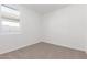 Neutral bedroom featuring a carpeted floor, window, and bright, natural light at 13242 W Hackamore Dr, Peoria, AZ 85383