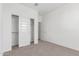 Bright bedroom featuring closet with sliding doors at 13242 W Hackamore Dr, Peoria, AZ 85383