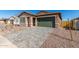 View of a charming single-story home with a paver driveway, desert landscaping and an attached garage at 13242 W Hackamore Dr, Peoria, AZ 85383