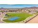 Aerial view of a grassy green neighborhood park with walking trails and a blue basketball court at 13242 W Hackamore Dr, Peoria, AZ 85383