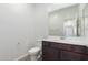 Powder room featuring a toilet and a vanity with mirror at 13242 W Hackamore Dr, Peoria, AZ 85383