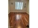 Hardwood flooring complements this room with bright, natural light shining through plantation shutters at 14009 N 30Th St, Phoenix, AZ 85032