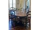 Dining area featuring a wooden table, seating for six, and a view of the stainless steel refrigerator at 14009 N 30Th St, Phoenix, AZ 85032