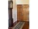Inviting entryway with hardwood floors, a decorative rug, and a classic grandfather clock by the front door at 14009 N 30Th St, Phoenix, AZ 85032