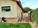 Exterior side view featuring a shed, well-maintained landscaping, and a neat pathway at 14009 N 30Th St, Phoenix, AZ 85032