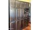 Spacious kitchen with custom wood cabinets, a built-in wine rack, and stainless steel appliances at 14009 N 30Th St, Phoenix, AZ 85032