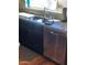 Well-appointed kitchen showcasing stainless steel appliances, granite countertops, and dark wood cabinetry at 14009 N 30Th St, Phoenix, AZ 85032