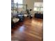 Inviting living room features gleaming hardwood floors, classic furnishings and plenty of natural light at 14009 N 30Th St, Phoenix, AZ 85032